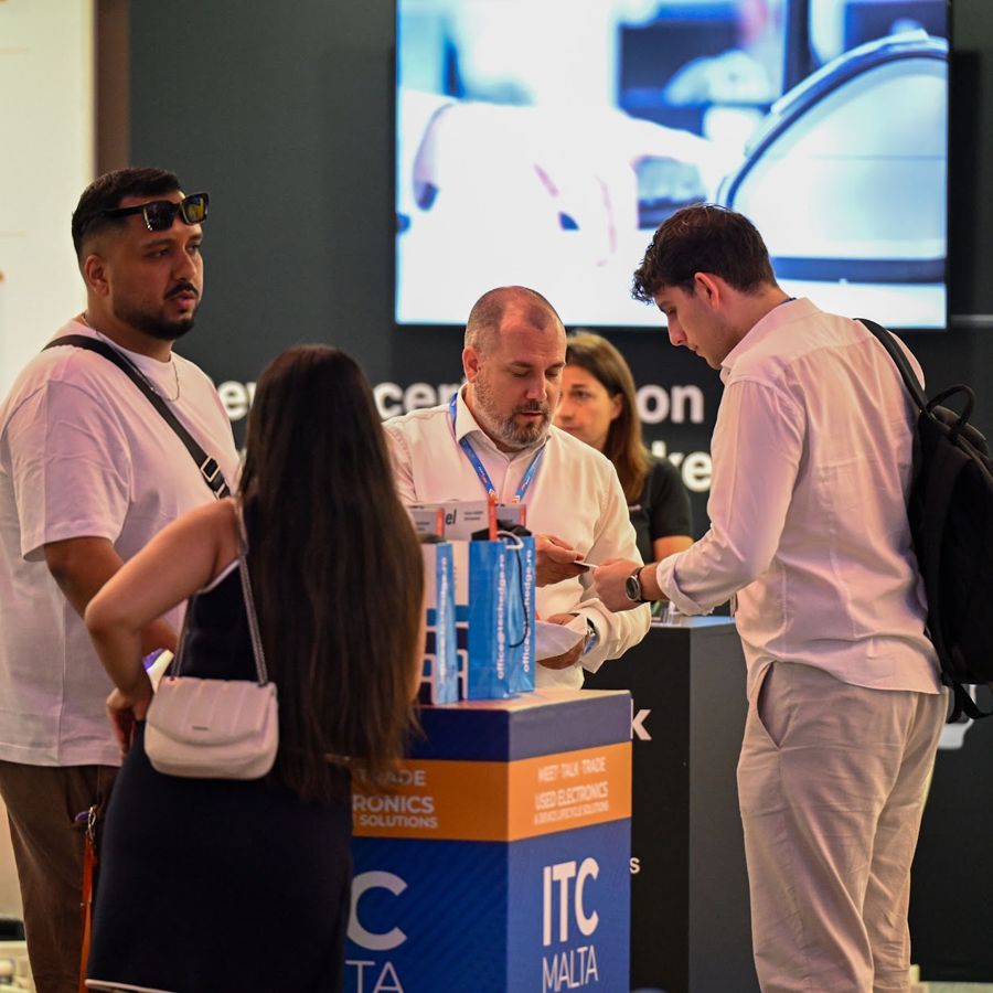 Mátyás Kurta in a stand conversation at ITC Malta